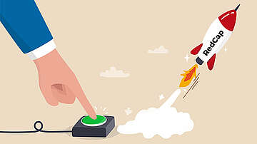 Cartoon hand presses a launch button to start a rocket, symbolizing the launch of 5G RedCap tests.